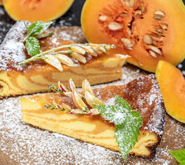 pie with fresh pumpkin sprinkled with powdered sugar