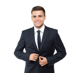 Handsome young man in stylish suit on white background