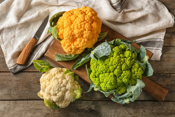 Color cauliflowers on wooden table