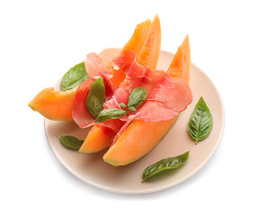 Delicious melon with prosciutto on white background