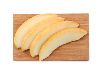 Wooden board with slices of ripe melon on white background