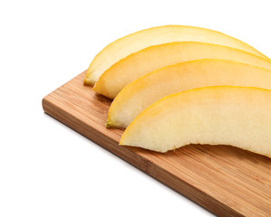 Wooden board with slices of ripe melon on white background