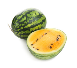 Whole and cut yellow watermelons on white background