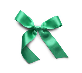 Beautiful bow made from green ribbon on white background