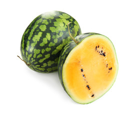 Whole and cut yellow watermelons on white background