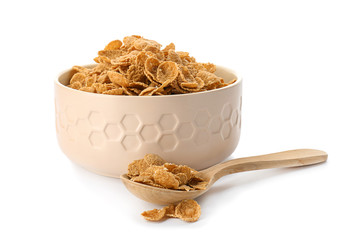 Bowl and spoon with healthy cornflakes on white background
