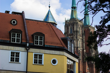 Obraz premium old city street building and catholic cathedral church towers in autumn contrast time