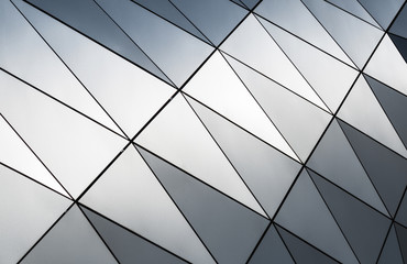 Details of geometrical patterns in the facade of a modern building.