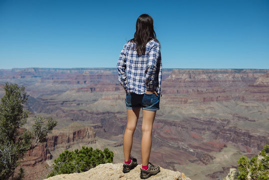 USA, Arizona, Grand Canyon National Park, Grand Canyon, back view of woman looking at view