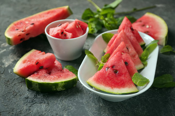 Plate with slices of watermelon on grunge background