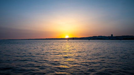Fototapeta na wymiar Sunset over the Tagus River; Lisbon, Portugal