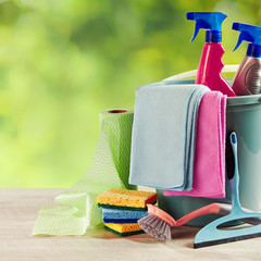 Selection of cleaning products on a garden table