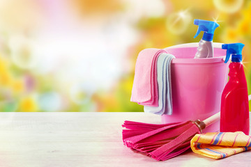 Colorful domestic cleaning equipment on a table
