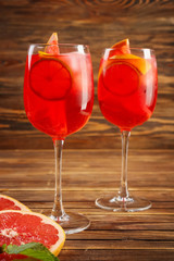 Fresh summer cocktail in glasses on wooden table