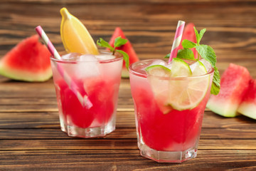 Fresh summer cocktail in glasses on wooden table