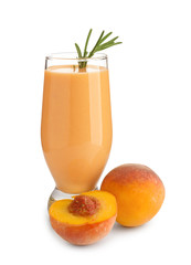 Glass with fresh peach smoothie on white background