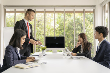 Young business man presented or discuss to client about business project in coference or meeting room.