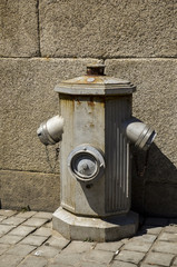 Old Portuguese hydrant on the street.
