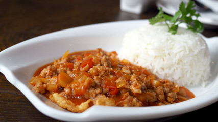 Fried pork with tomato sauce. Eggs bomb,cooking Thai Food.