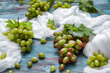 Fresh ripe grapes on wooden table