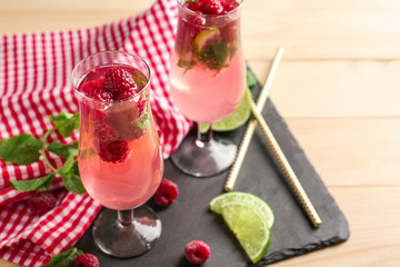 Glasses of fresh raspberry mojito on slate plate