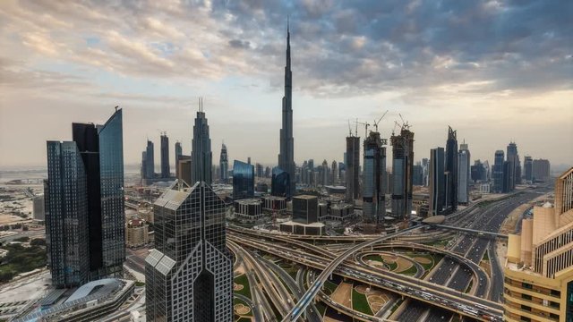Scenic view on downtown Dubai, United Arab Emirates at sunset. 4K day-to-night transition timelapse.