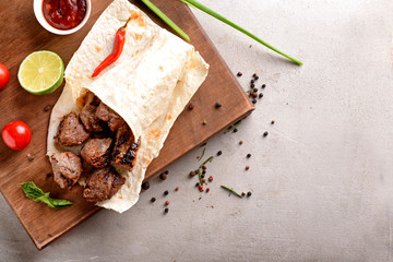 Lavash with delicious shish kebab on board