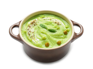Tasty zucchini soup in saucepan on white background