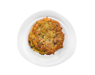 Plate with zucchini pancakes isolated on white