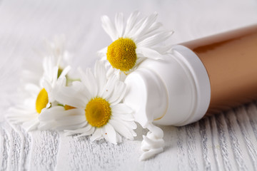 face cream or body cream with camomile flower