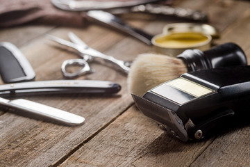 Electric clipper on wooden surface