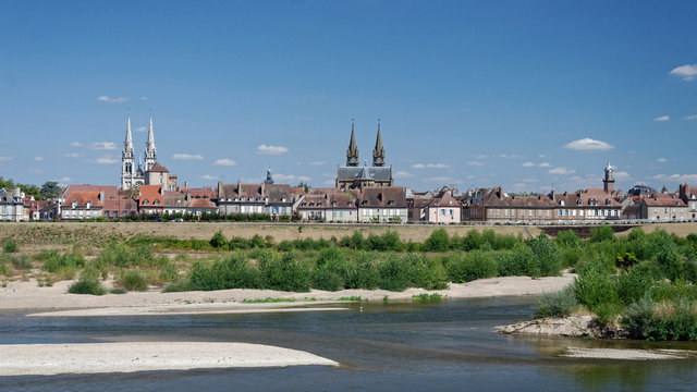 Panoramic view of a french town by a riverside