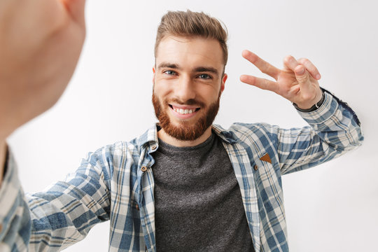 Portrait of a cheerful young bearded man
