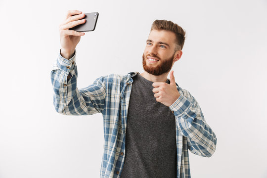 Portrait of a cheerful young bearded man