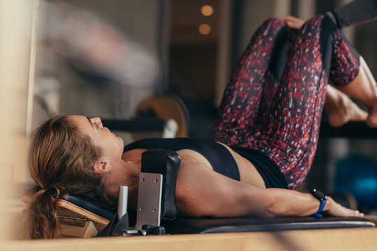 Pilates woman training in a gym