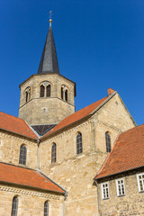 Fototapeta na wymiar Clock tower of the St. Godehard church in Hildesheim, Germany