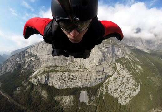 self-portrait of the base jumper in flight from the cliff, base jumping, wingsuit