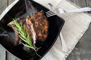 On a platter lying pork ribs grilled