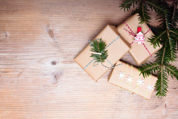Christmas presents on wooden background, retro style with copy space