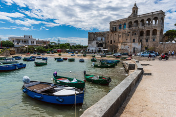Enchanted sea. Boats in the bay of the abbey of San Vito