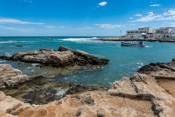Enchanted sea. Boats in the bay of the abbey of San Vito