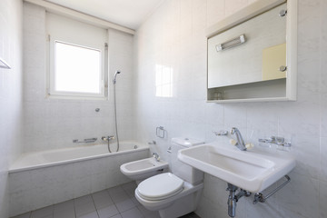 Obraz na płótnie Canvas Bathroom with tiles and window, vintage