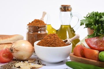 Picture of spices with vegetables bread and olive oil