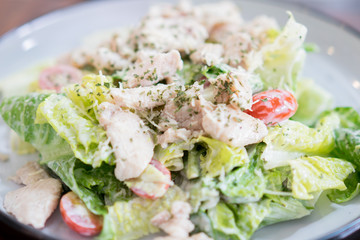 Caesar salad in a dish is a menu in the restaurant.