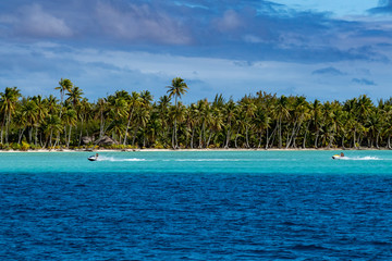 jet ski in french polynesia coconut beach crystal water