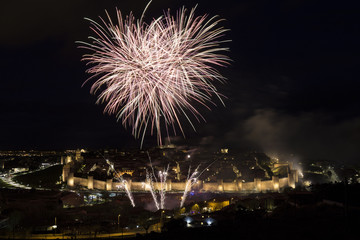 Fototapeta premium night views of fireworks in the city of Avila in Spain, medieval walled city perfectly preserved 