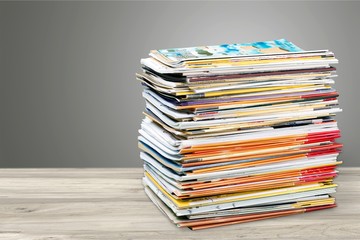Pile of newspapers on white background