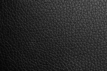 black paper texture or background with spotlight, dark tone 