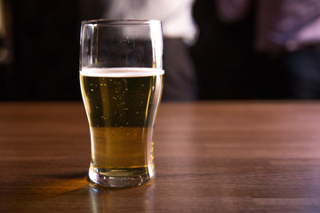 glasses of beer on the table in a bar or pub