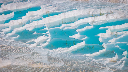 The enchanting pools of Pamukkale in Turkey. Pamukkale contains hot springs and travertines,...